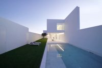 serenely white modern minimalist house with pool